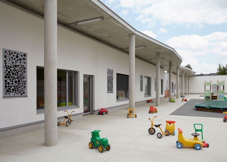 Timber-clad kindergarten in France by Topos Architecture