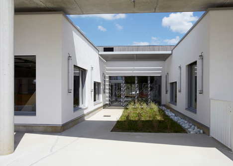 Timber-clad kindergarten in France by Topos Architecture