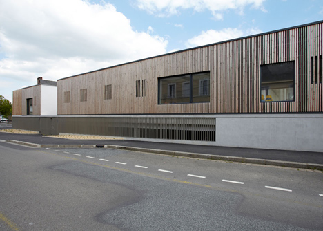 Timber-clad kindergarten in France by Topos Architecture