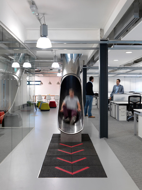 The Workshop offices with a slide through the centre by Guy Holloway