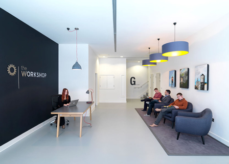 The Workshop offices with a slide through the centre by Guy Holloway