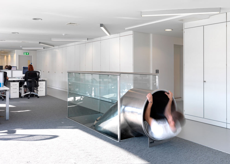The Workshop offices with a slide through the centre by Guy Holloway