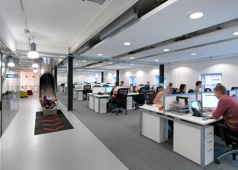 The Workshop offices with a slide through the centre by Guy Holloway
