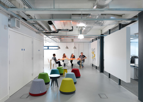 The Workshop offices with a slide through the centre by Guy Holloway