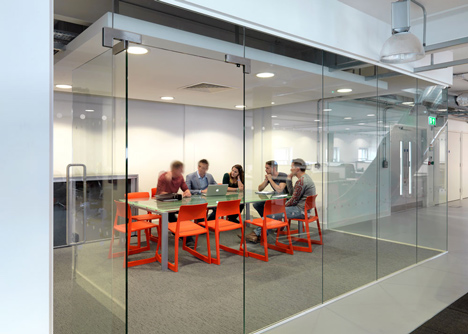 The Workshop offices with a slide through the centre by Guy Holloway