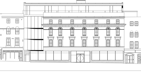 Street elevation of The Workshop offices with a slide through the centre by Guy Holloway