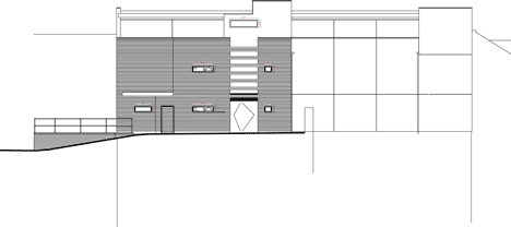 Rear elevation of The Workshop offices with a slide through the centre by Guy Holloway