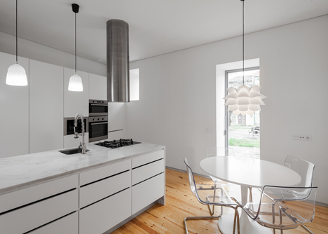 Portuguese townhouse meets Alpine chalet at this renovation by Tiago do Vale Arquitectos