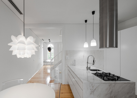 Portuguese townhouse meets Alpine chalet at this renovation by Tiago do Vale Arquitectos