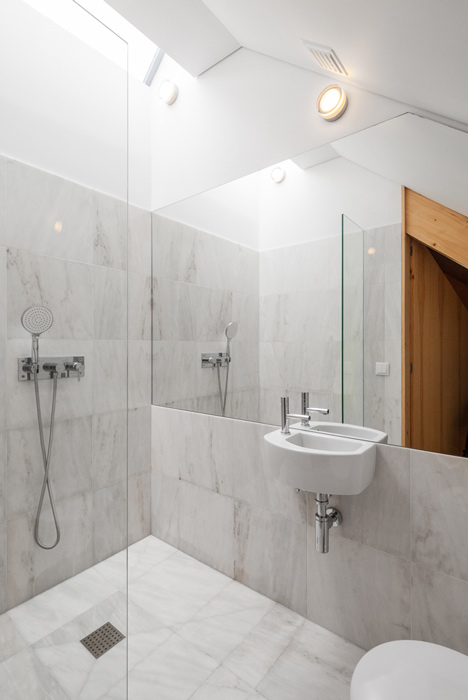 Portuguese townhouse meets Alpine chalet at this renovation by Tiago do Vale Arquitectos