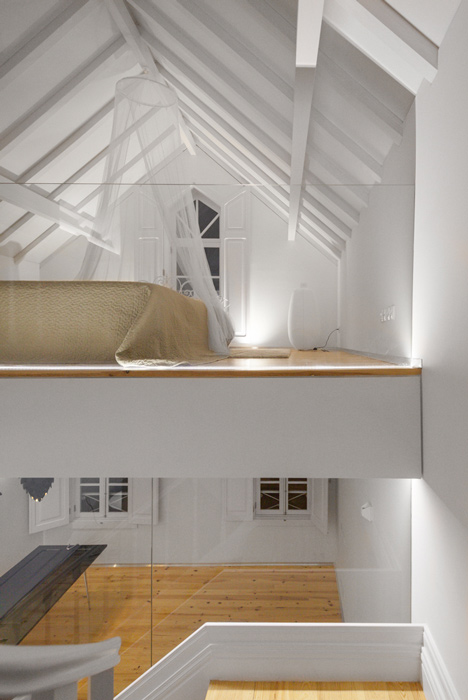 Portuguese townhouse meets Alpine chalet at this renovation by Tiago do Vale Arquitectos