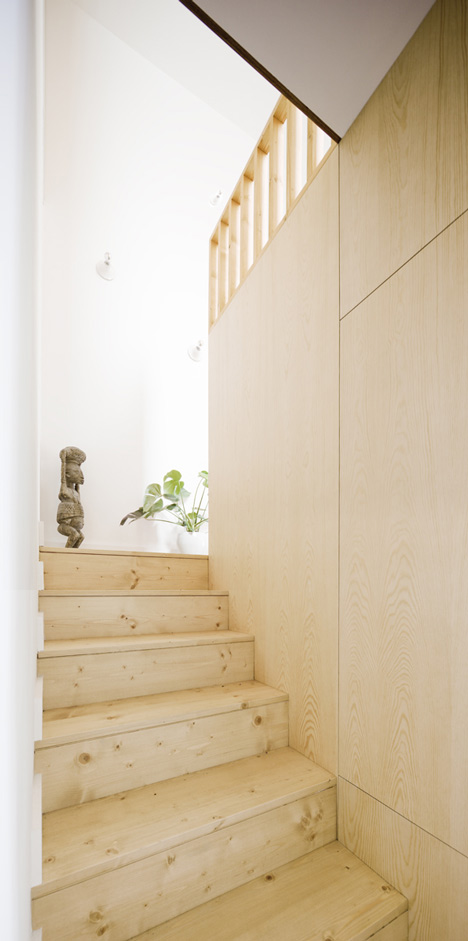Barcelona apartment by Bach Arquitectes with colourful floor tiles arranged in stripes
