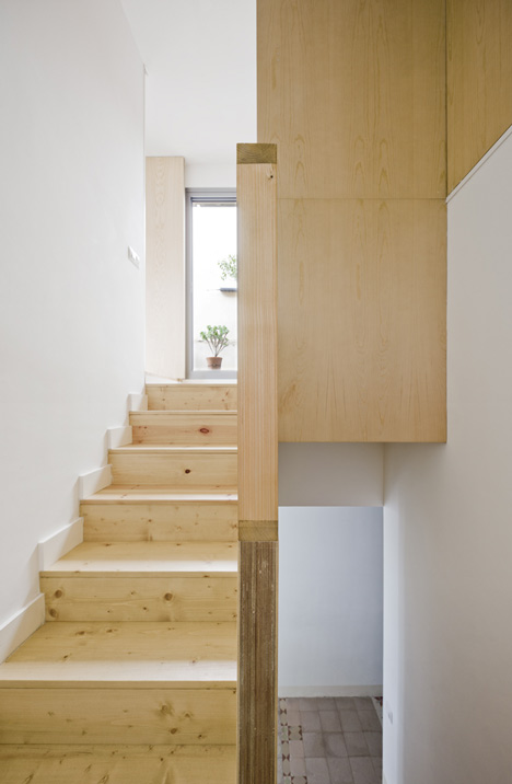 Barcelona apartment by Bach Arquitectes with colourful floor tiles arranged in stripes