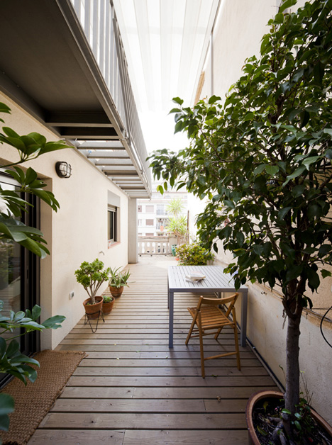 Barcelona apartment by Bach Arquitectes with colourful floor tiles arranged in stripes