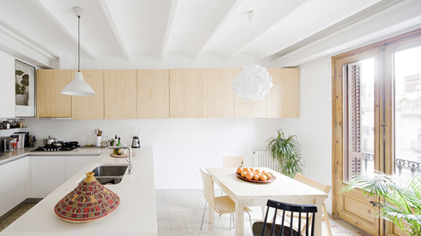 Barcelona apartment by Bach Arquitectes with colourful floor tiles arranged in stripes