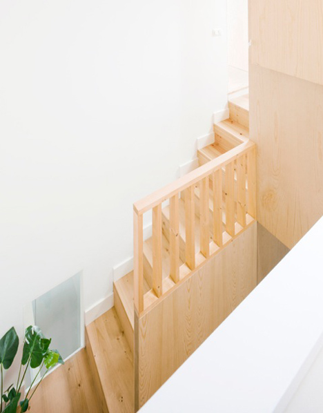Barcelona apartment by Bach Arquitectes with colourful floor tiles arranged in stripes