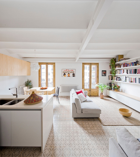 Barcelona apartment by Bach Arquitectes with colourful floor tiles arranged in stripes