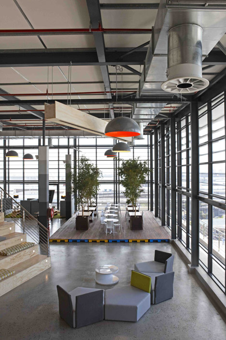99c offices by Inhouse Brand Architects features<br /> a waiting room inside a shipping container