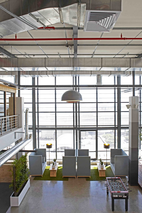 99c offices by Inhouse Brand Architects features<br /> a waiting room inside a shipping container