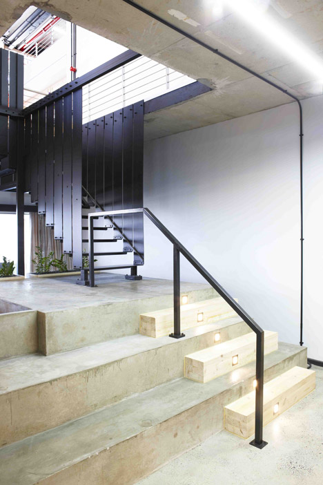 99c offices by Inhouse Brand Architects features<br /> a waiting room inside a shipping container