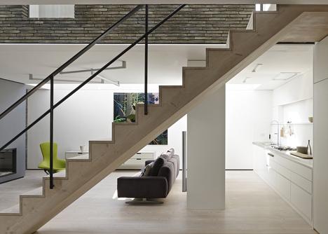 Blackbox mews house by Form_art Architects has brick walls that continue inside