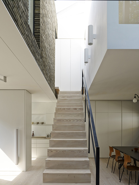 Blackbox mews house by Form_art Architects has brick walls that continue inside