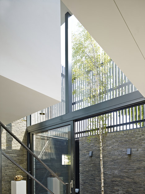 Blackbox mews house by Form_art Architects has brick walls that continue inside