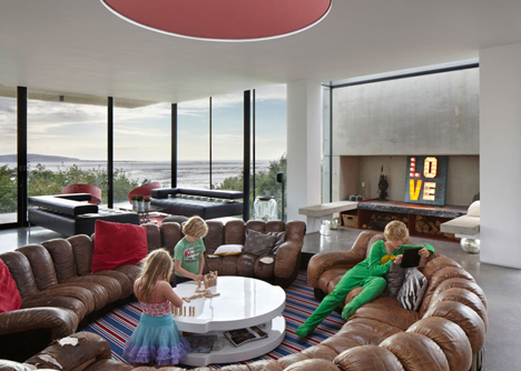 Coastal concrete house on a red sandstone base by ShedKM