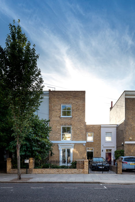 Curvy timber extension by Scott Architects features a sloping grass roof