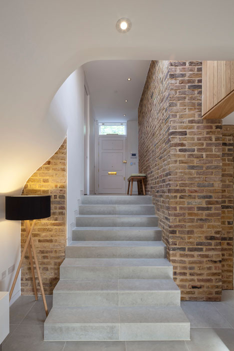 Curvy timber extension by Scott Architects features a sloping grass roof