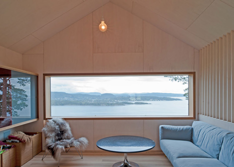 Double-gabled house overlooking a Norwegian fjord by Schjelderup Trondahl Architects
