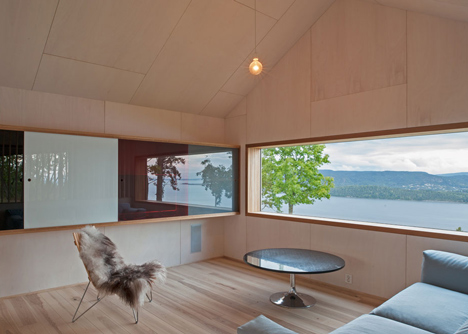 Double-gabled house overlooking a Norwegian fjord by Schjelderup Trondahl Architects