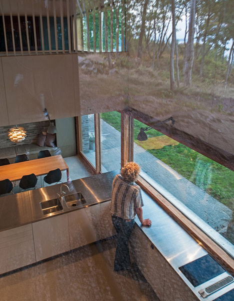 Double-gabled house overlooking a Norwegian fjord by Schjelderup Trondahl Architects