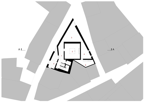 Ground floor of Jewish cultural centre with an acutely angled corner by Goncalo Byrne Arquitectos