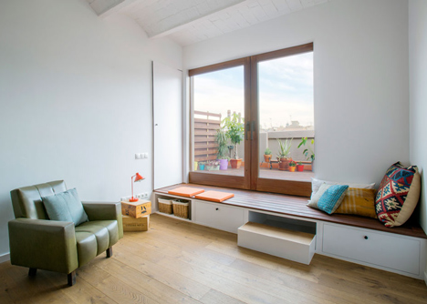 Nook Architects add patterned floor tiles and window seat to Barcelona apartment renovation