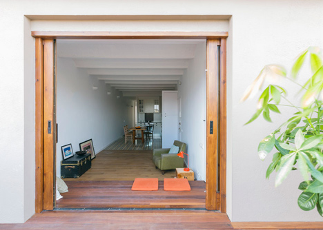 Nook Architects add patterned floor tiles and window seat to Barcelona apartment renovation