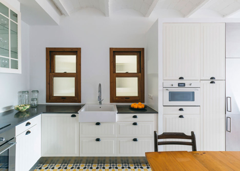 Nook Architects add patterned floor tiles and window seat to Barcelona apartment renovation