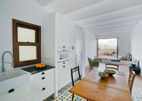 Nook Architects add patterned floor tiles and window seat to Barcelona apartment renovation