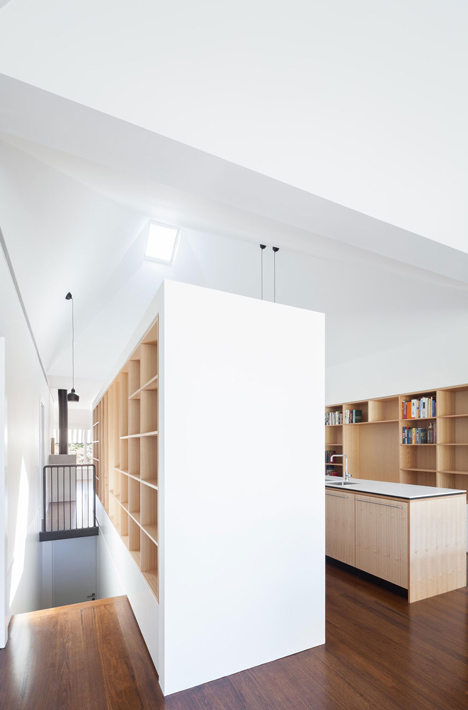 Renovated single-storey house with distorted ceiling voids by Tribe Studio