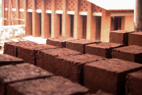 Children's library in Africa with rammed earth walls by BC Architects
