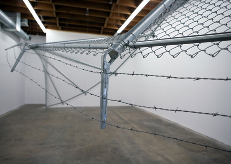 Twisting barbed wire fence installed by Didier Faustino at Cincinnatis Contemporary Arts Center