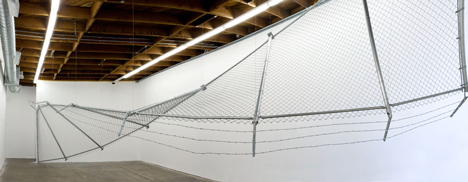 Twisting barbed wire fence installed by Didier Faustino at Cincinnatis Contemporary Arts Center