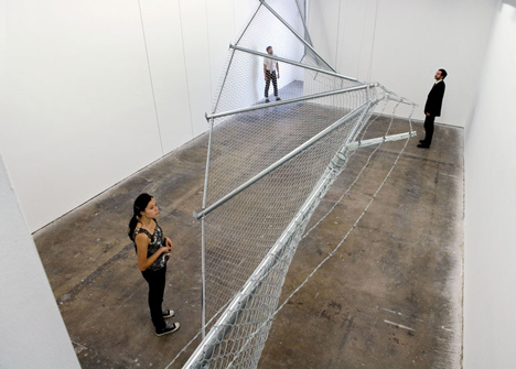 Twisting barbed wire fence installed by Didier Faustino at Cincinnatis Contemporary Arts Center