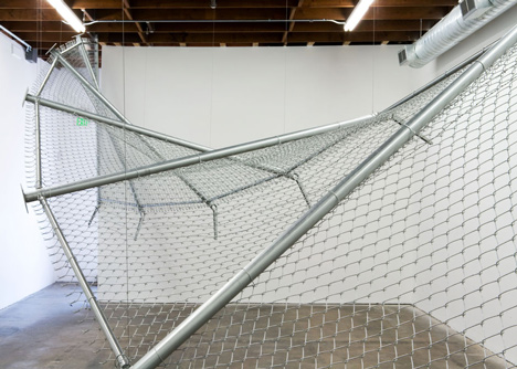 Twisting barbed wire fence installed by Didier Faustino at Cincinnatis Contemporary Arts Center
