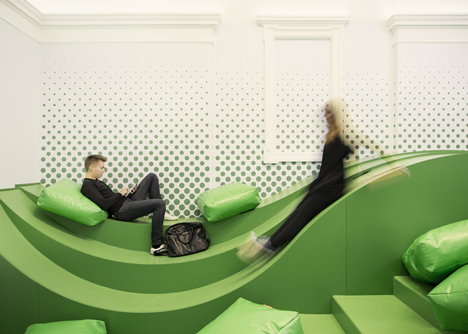 Wavy green lounge in a Solvenian school by Svet Vmes Architects