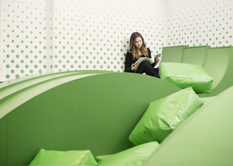 Wavy green lounge in a Solvenian school by Svet Vmes Architects