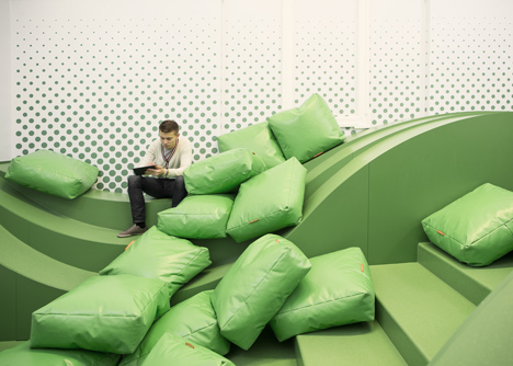 Wavy green lounge in a Solvenian school by Svet Vmes Architects