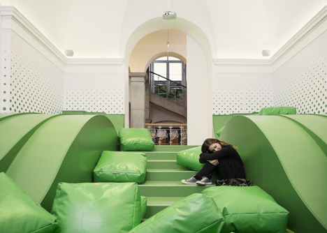Wavy green lounge in a Solvenian school by Svet Vmes Architects