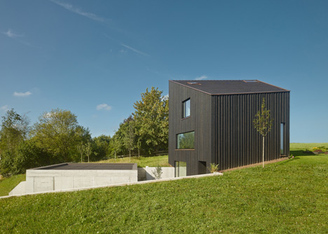 s_DenK house by SoHo Architektur has a kinked facade