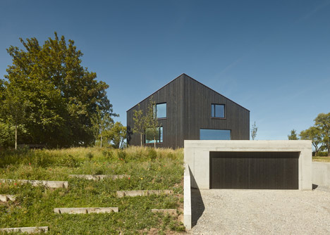 s_DenK house by SoHo Architektur has a kinked facade